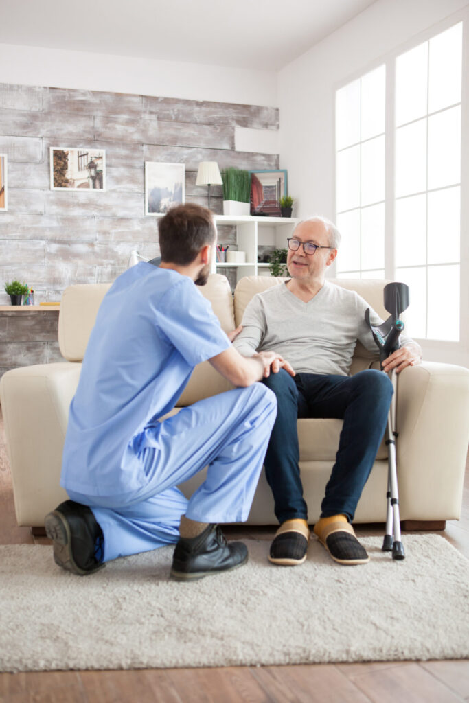 old man with mental health recognise his doctor nursing home caretaker talking with old man